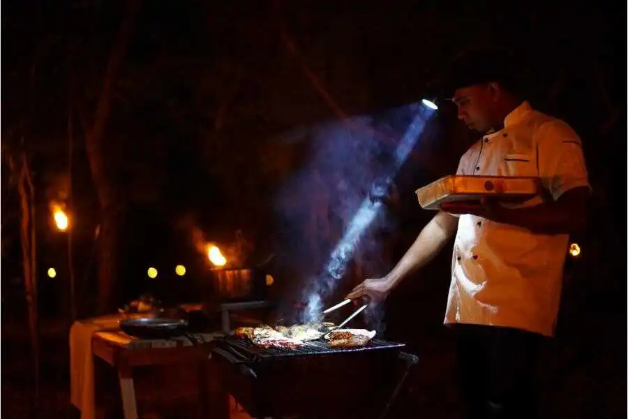 big game staff making dinner at udawalwe sri lanka experiential journey