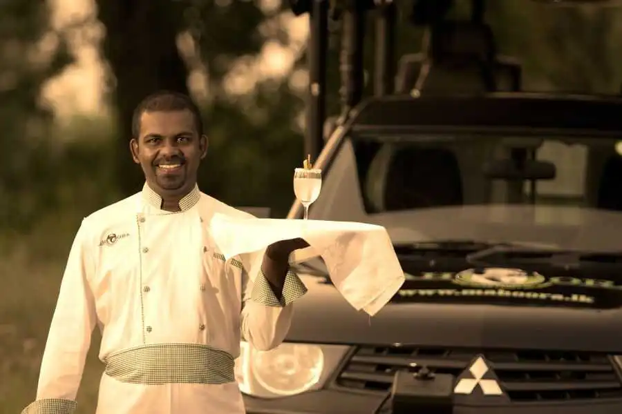 waiter at wilpattu campsites in sri lanka experiential journey