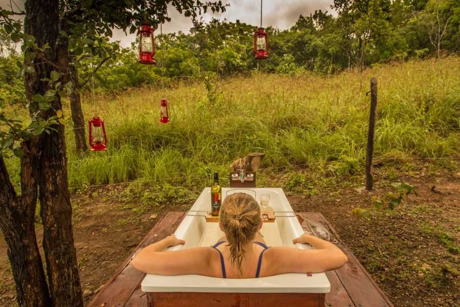 taking a wild bath at haspokuna bush walk camps in sri lanka experiential journey