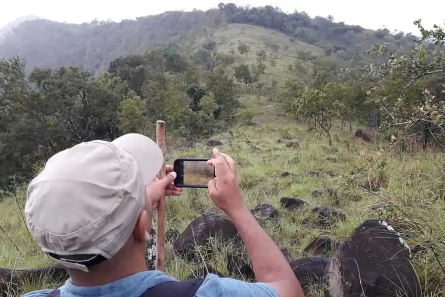 taking photographs during their trekking t ahaspokuna in sri lanka experiential journey