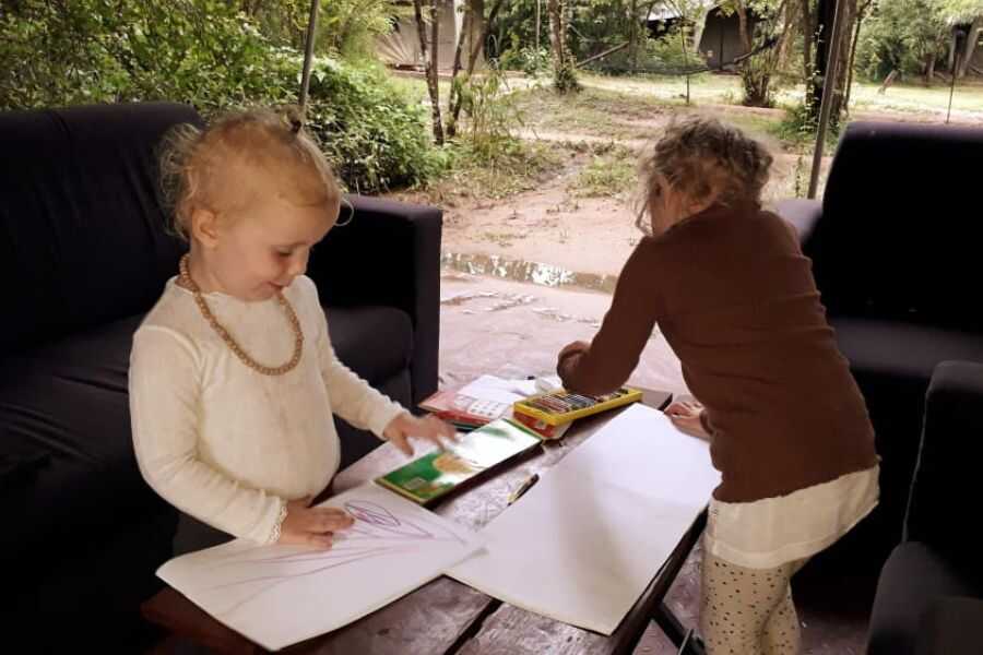 two children are drawing at our campsites in sri lanka experiential journey
