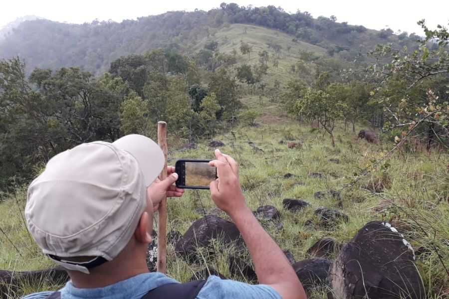 taking photographs during their trekking to ahaspokuna in sri lanka experiential journey